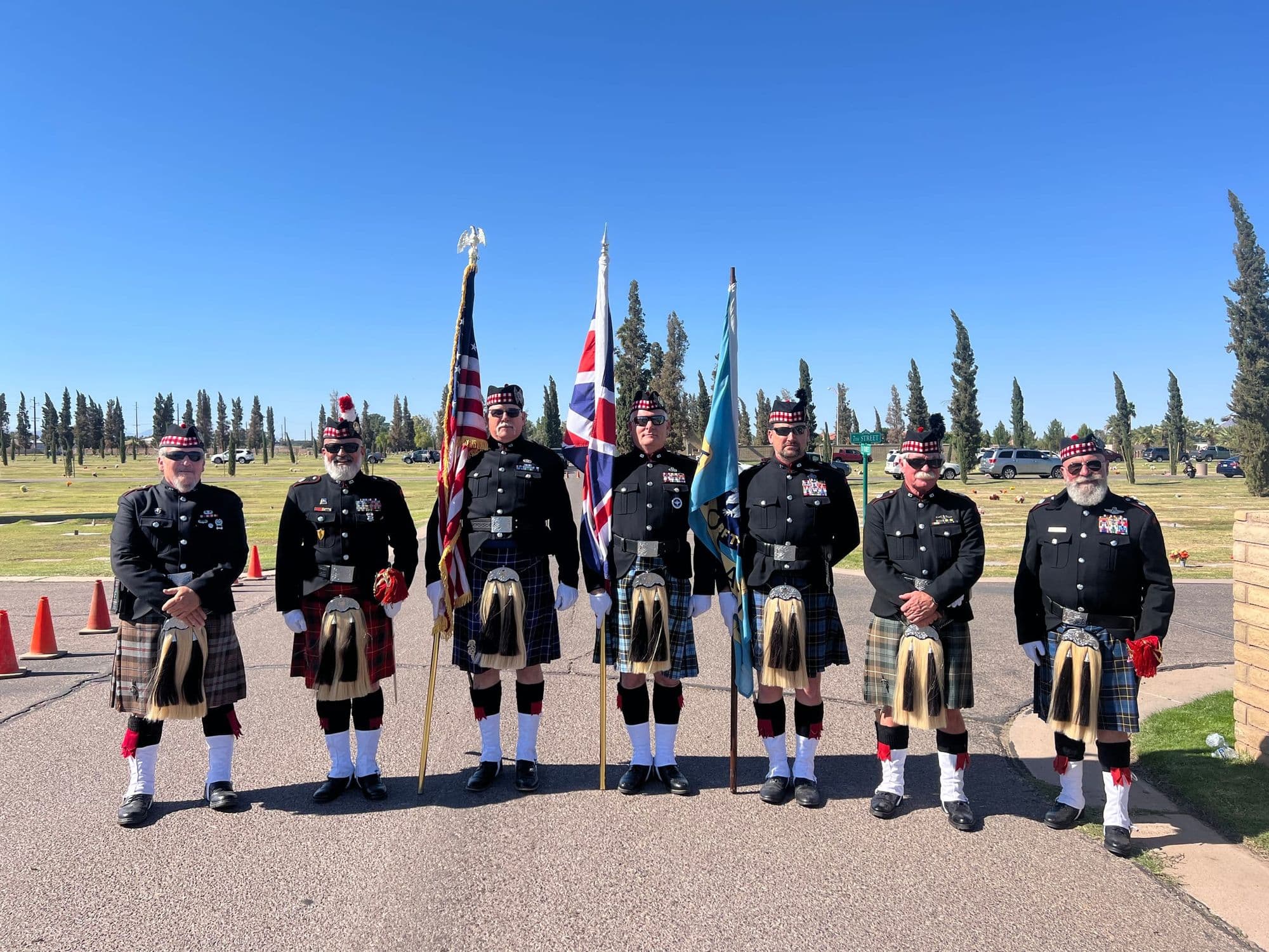 Color guard with RAF, US, and Arizona flags at the BFTS Remembrance Day ceremony.